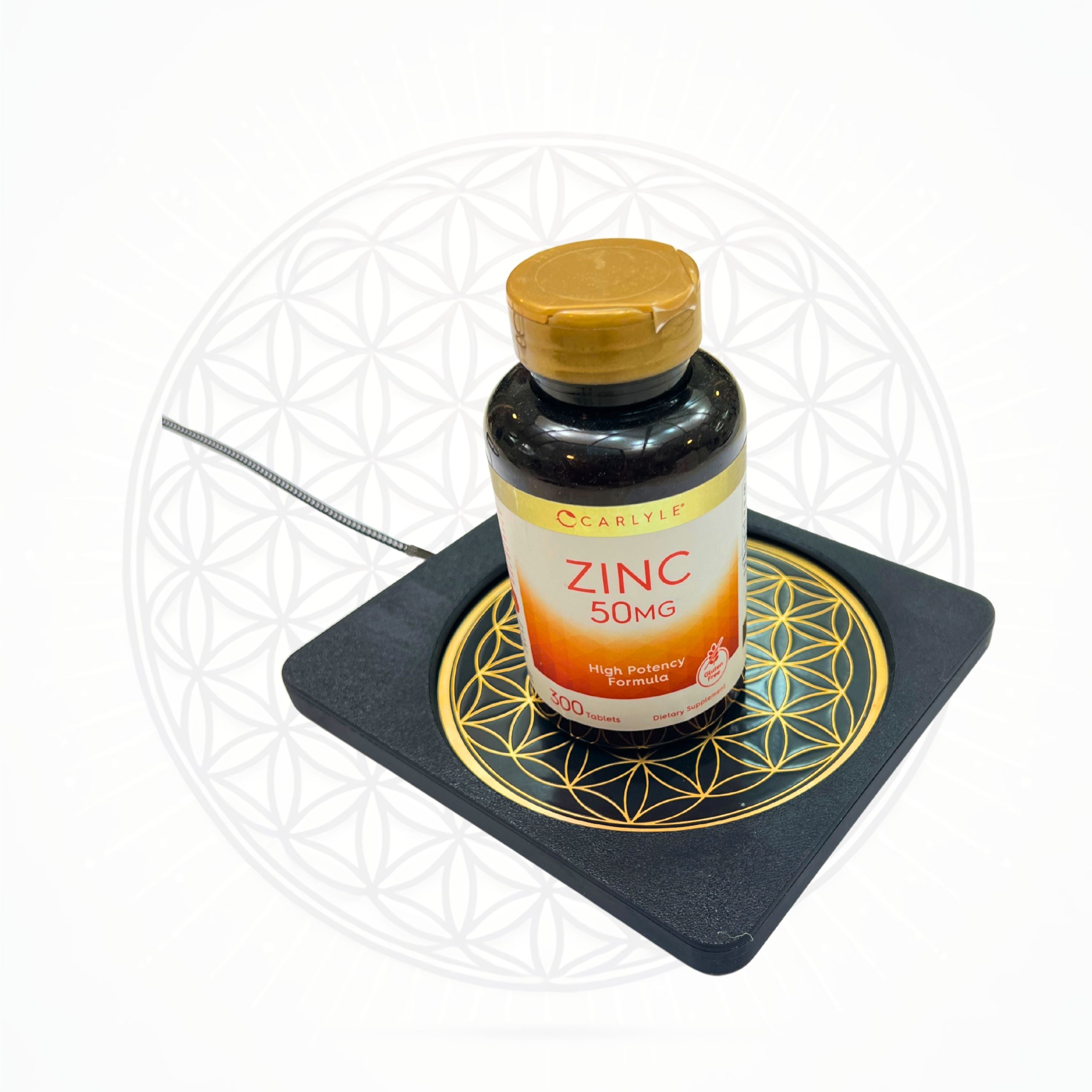 Metatronic Flower of Life Frequency Imprinter by Sacred Ritual Oils with zinc supplement bottle on top